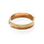 A 9 Carat Gold Engraved Hinged Bangle, inner measurements 6.1cm by 5.4cmGross weight 24.2 grams