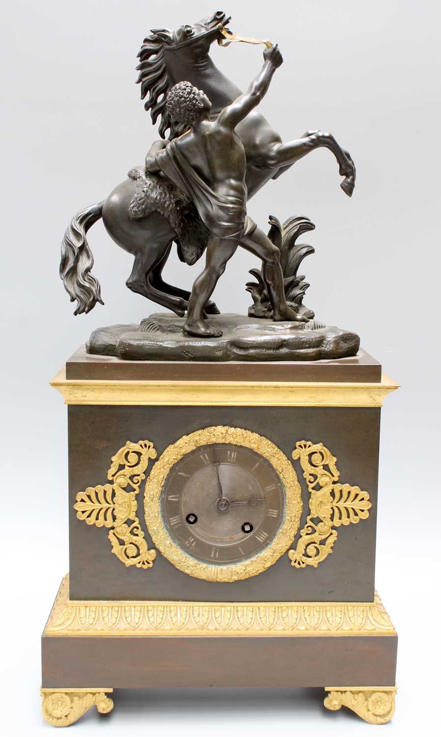 A Gilt Metal Mounted Mantel Clock, surmounted by a Marley horse, twin barrel movement, striking on a