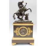 A Gilt Metal Mounted Mantel Clock, surmounted by a Marley horse, twin barrel movement, striking on a