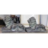 A Pair of Patinated Composition Garden Lions, modelled in recumbant pose, 38cm long