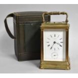 A Brass Strike and Repeat Alarm Carriage Clock, retailed by John Walker, 236 Regent St, London,