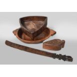 A Tribal Carved Hardwood Feast Bowl With Triangular Handles, together with a similar bowl, a