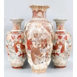 A 19th Century Japanese Satsuma Vase, 57cm high together with a similar smaller pair of vases, all