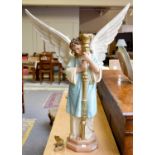 A Painted Figural Plaster Candle Stand, formed as an Angel in Renaissance style, 88cm high