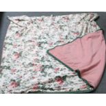 A Floral Bed Cover, with green trim and pink reverse
