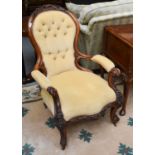 A Victorian Walnut Framed Carved Open Armchair, with button back