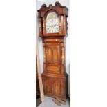 A Victorian Mahogany Eight Day Longcase Clock, with painted arch top dial, incorporating a moon