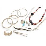 A Collection of Modern Silver Jewellery, comprising of a two necklaces, a bracelet and a pair of