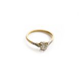 A Diamond Solitaire Ring, with diamond set shoulders, stamped '18CT' and 'PLAT', finger size O The