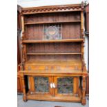A Victorian Oak Puginistic Dresser, with leaded glass doors, 143cm by 60cm by 220cm Does come in two