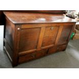 An 18th century Oak Mule Chest, with plank top, three panelled front over two drawers, 142cm by 54cm