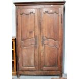 An 18th century French Oak Armoir, with carved panelling and iron mounts (interior converted)