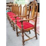 A Set of Seven Carved and Inlaid Oak Early 20th Century Dining Chairs, with carved arch top cresting