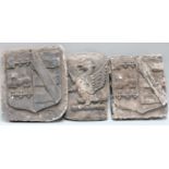 Three plaster Cast Heraldic Crests, 19th century, two formed as shields and the other depicts an