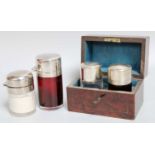 Four Various Silver-Mounted Glass Scent-Bottles, each cylindrical, two with ruby glass bodies and