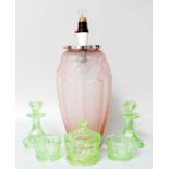 An Art Deco Jobling Pink Frosted Glass Table Lamp, and an art deco green glass dressing table set
