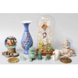 An Early Victorian Figure under a Glass Dome, together with two Victorian snow globes, a