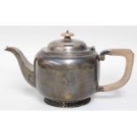 An Edward VIII Silver Teapot, by Thomas Bradbury and Sons Ltd., Sheffield, 1936, circular and on