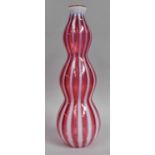 A Czechoslovakian Red Glass Vase, with opalescent white vertical ribbing, unmarked, 30.5cm high