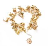 A 9 Carat Gold Double Curb Link Bracelet, suspending sixteen charms including a rabbit, a field