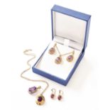 A 9 Carat Gold Amethyst Pendant on Chain and Matching Earrings, the pear cut amethyst in a yellow