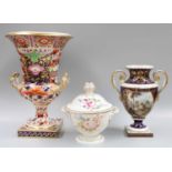 A Derby Porcelain Campana Urn, 19th century, painted in the Imari style with panels of flowers,