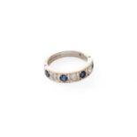 An 18 Carat White Gold Sapphire and Diamond Seven Stone Ring, four round cut sapphires alternate