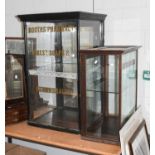 A Large Ebonised Victorian Style Shop Display, with mirrored back and stencilled advertising, 64cm