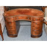 An Edwardian Leather Inset Mahogany Reniform Writing Table, 121cm by 75cm by 74cm