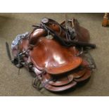 An American Stitched Leather Western Saddle, with string girth and wood stirrups; a leather bull