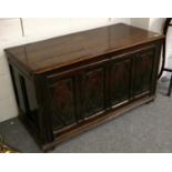 A 17th Century Joined Oak Chest, the hinged lid above four lozenge carved panels and carved with