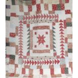Late 19th/Early 20th Century Patchwork Quilt, with a central square pieced with a red cotton star,