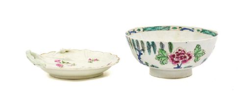 A Bow Porcelain Waste Bowl, circa 1755, painted in the famille rose style with a fringed tree, peony