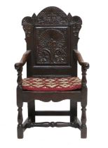 A Mid 17th Century English Joined Oak Wainscot Armchair, with single panelled back support, the