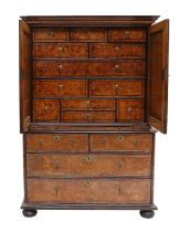 A George I Burr Maple, Rosewood-Crossbanded and Pewter-Strung Cabinet on Chest, early 18th