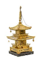 A Japanese Gilt and Patinated Bronze Temple, Meiji period, with ribbed finial, the upper floor