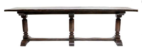 A 17th Century-Style Oak Refectory Table, the rectangular top with cleated ends, on three turned