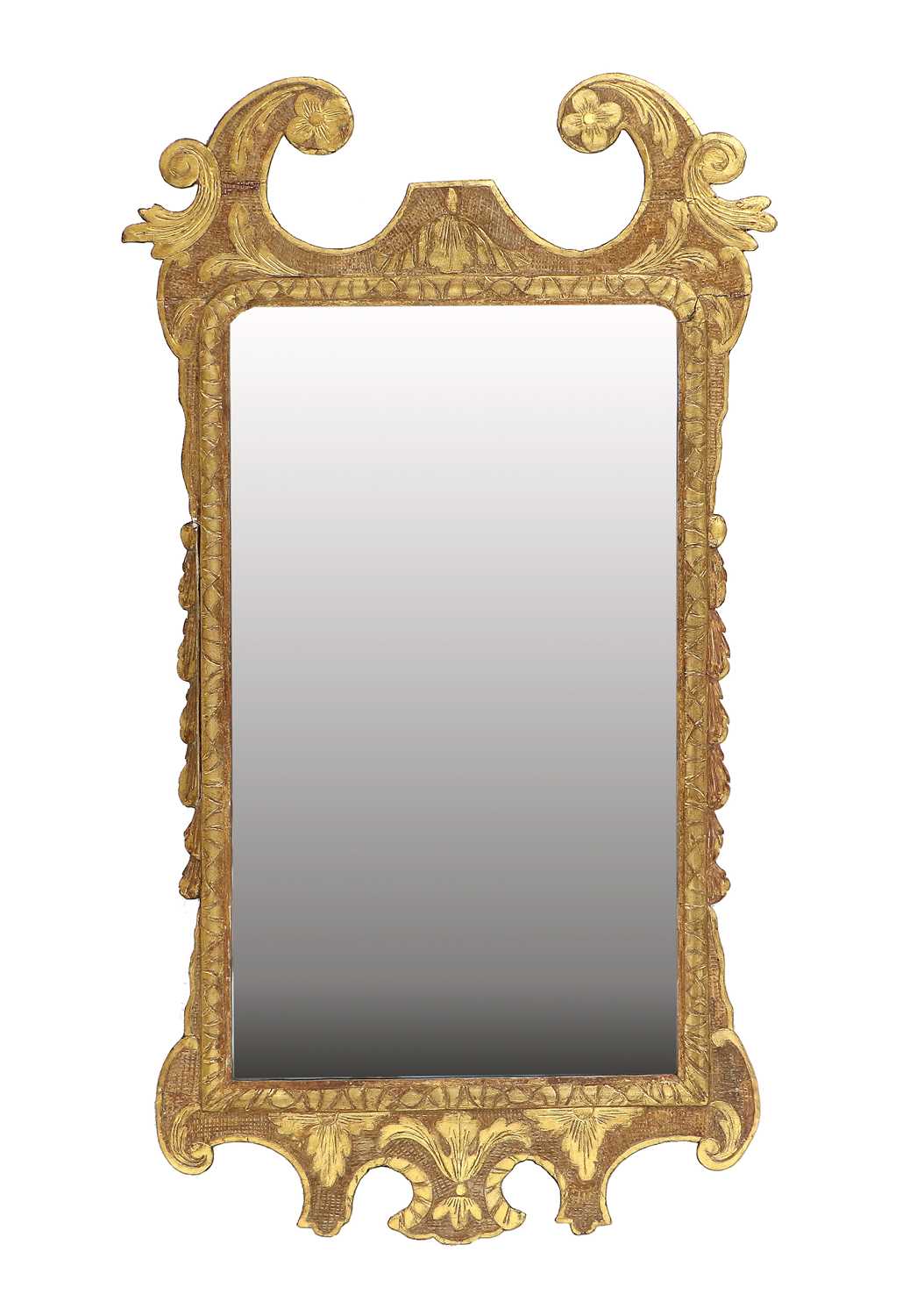 A George II Carved Giltwood Mirror, circa 1740, the plain mercury plate within a carved border,