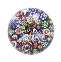 A Baccarat Millefiori Paperweight, circa 1850, with close packed canes 8cm diameter No chips, cracks