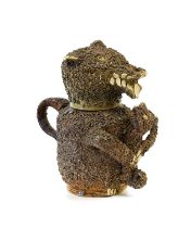 A Nottingham Stoneware Bear Jug and Cover, mid 18th century, modelled seated with shredded clay