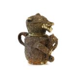 A Nottingham Stoneware Bear Jug and Cover, mid 18th century, modelled seated with shredded clay