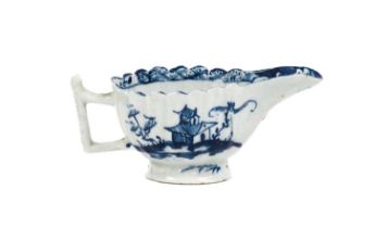 A Lowestoft Porcelain Butterboat, circa 1765, of fluted oval form with angular handle, painted in
