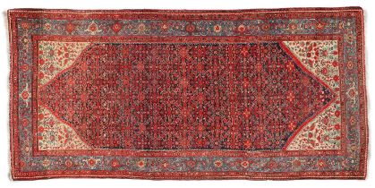~ Feraghan Rug West Iran, circa 1930 The indigo lozenge Herati field enclosed by ivory spandrels and