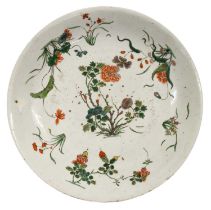 A Chinese Porcelain Dish, Kangxi, painted in famille verte enamels with flowering branches and