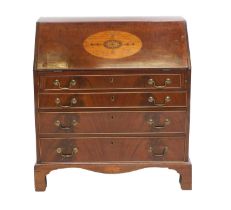 A George III Mahogany, Satinwood, Harewood and Marquetry-Inlaid Bureau, the fall front enclosing a