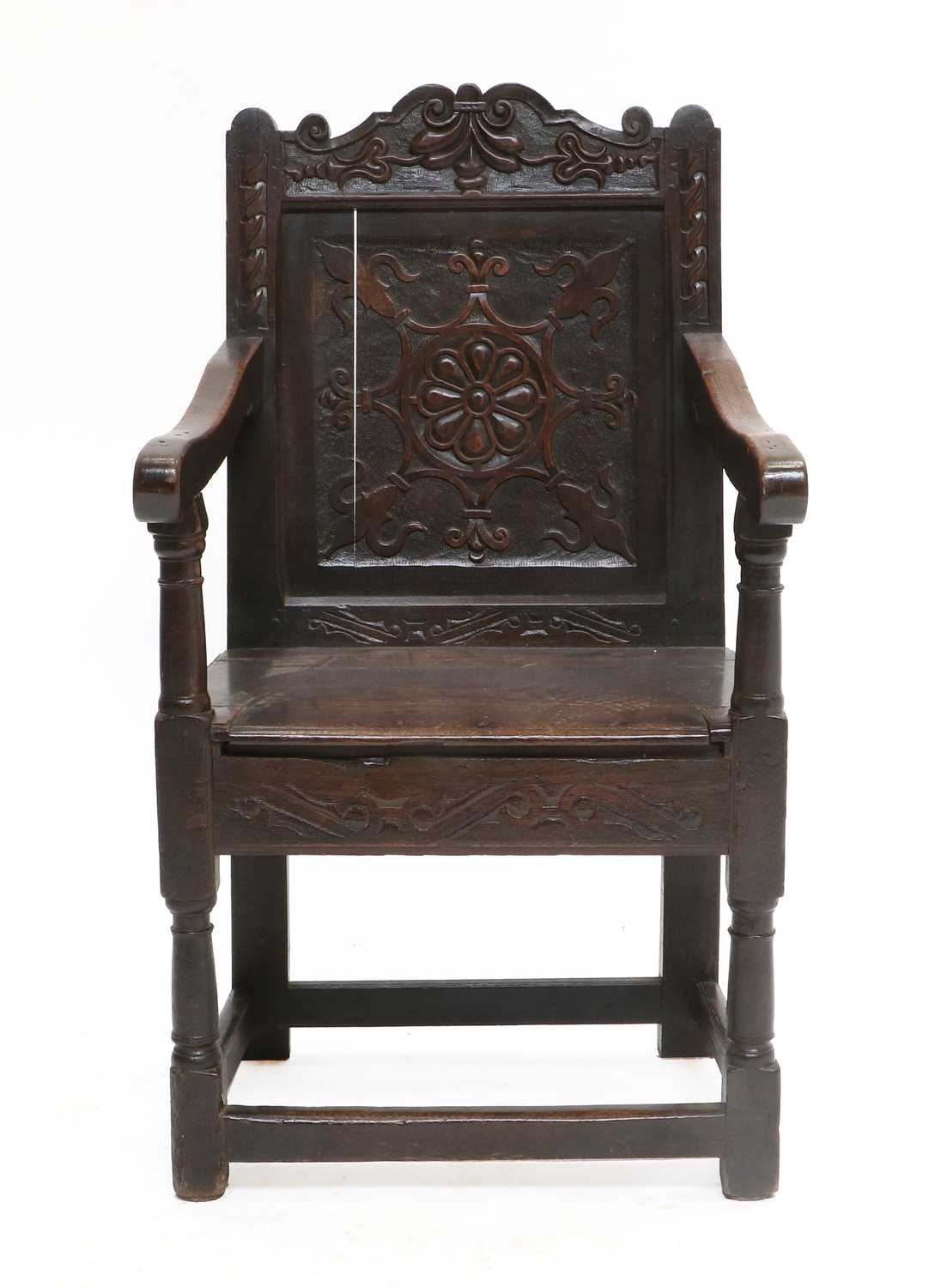 A Late 17th Century Joined Oak and Carved Wainscot Armchair, probably Scottish, the top rail