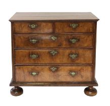 A Queen Anne Walnut, Featherbanded and Crossbanded Straight-Front Chest of Drawers, circa 1710,