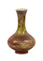 A Chinese Sang de Boeuf Porcelain Small Vase, Qing Dynasty, of pear shape with flared neck 12cm high