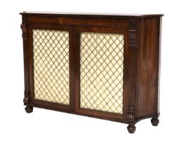 A Regency Rosewood and Brass Grille Door Cabinet, early 19th century, the moulded frieze above two
