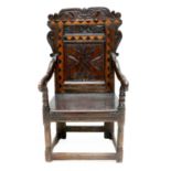 A 17th Century Joined Oak and Parquetry-Decorated Wainscot Armchair, probably Yorkshire/Leeds, the